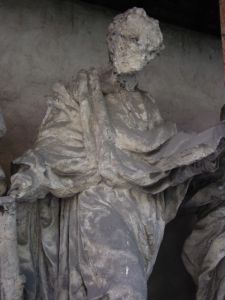 damaged apostle sculpture